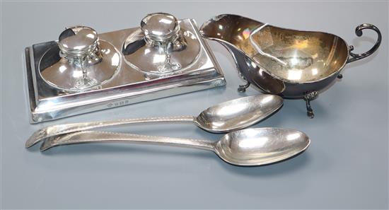 A George V silver double inkwell stand, London 1912, a silver sauce boat and pair of bright cut engraved table spoons